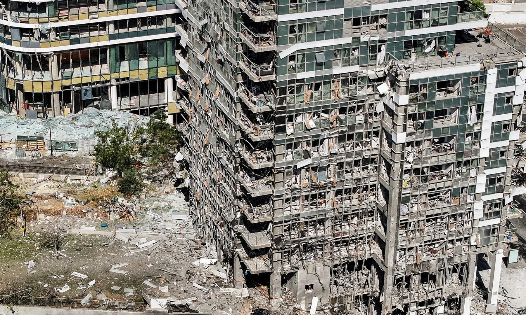 Iran Intensifies Strikes on Israel as Conflict Escalates; Use of Cluster Munitions Disputed